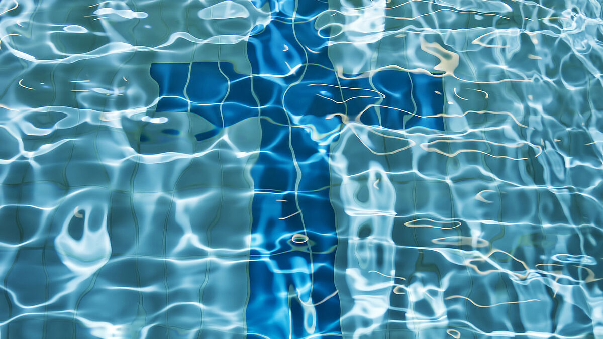 Sign of the cross on the bottom of a swimming pool.