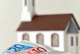Symbolbild Kirche und Geld