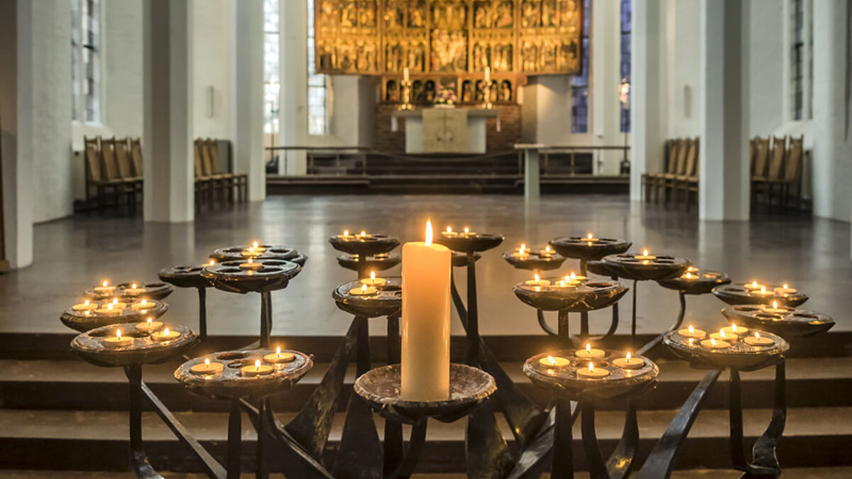 Candles in Protestant Nikolai church, Kiel, Germany