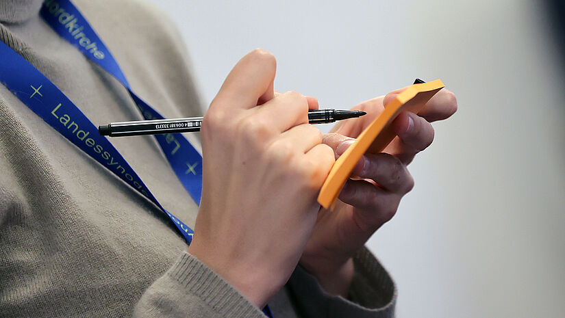Zettel mit Stift