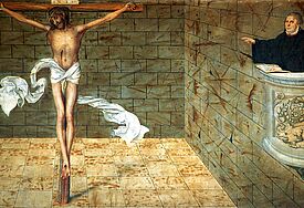 Ausschnitt aus der Predella (Sockel) des Reformationsaltars in der Wittenberger Stadtkirche St. Marien von Lucas Cranach dem Älteren (1472 - 1553). Rechts der Reformator Martin Luther, der mit einer Hand auf der Bibel, auf Jesus Christus zeigt (c) epdBild